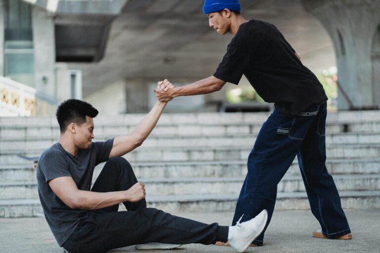 guy helping another guy